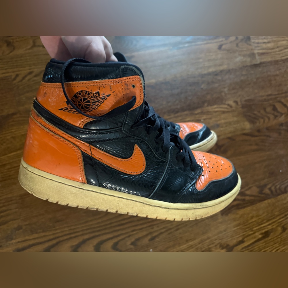Jordan High-Top Sneakers in Black and Orange